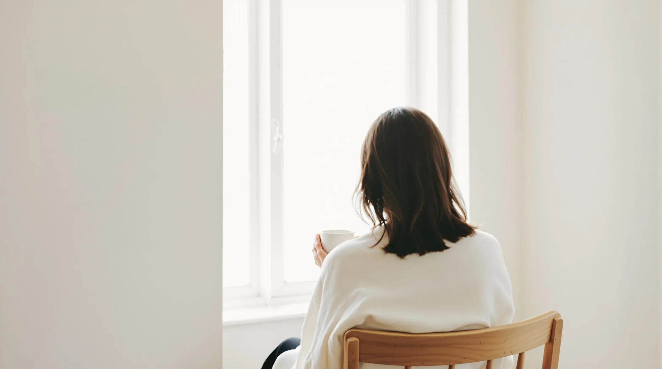 Seated figure in calm light